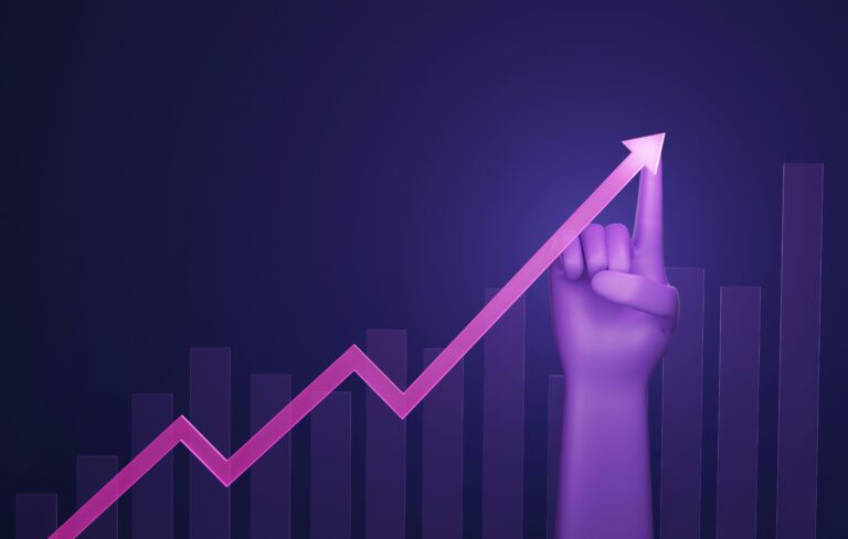 Hand pointing upward alongside a rising graph, symbolizing how purpose is the hidden accelerator behind career advancement and professional growth.